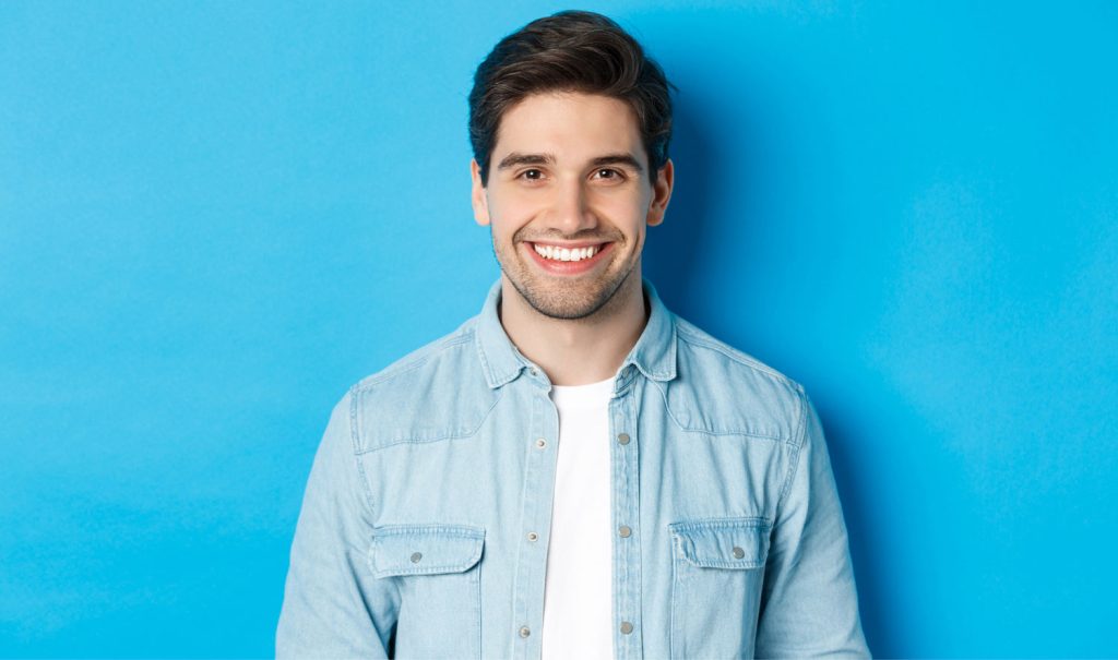 Man Smiling Post Root Canal Treatment In Boynton Beach, FL