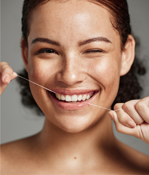 Woman Flossing Her Teeth