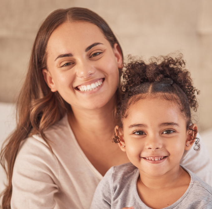 Smiling Mother And Daughter