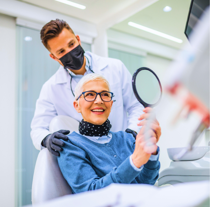 Woman Smiling With Dentist During A Dental Check-up