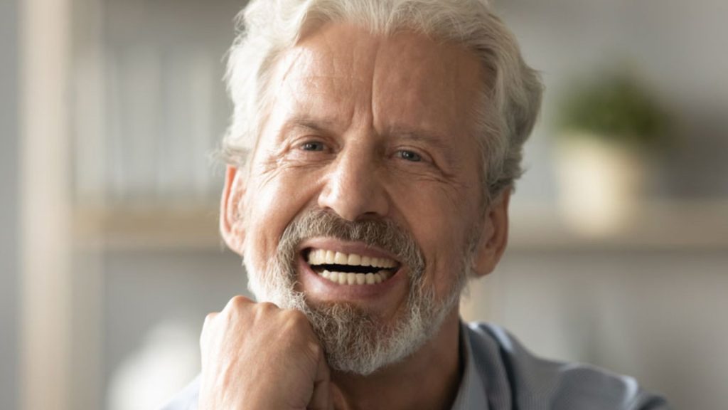 Smiling Elderly Man With Dental Implants