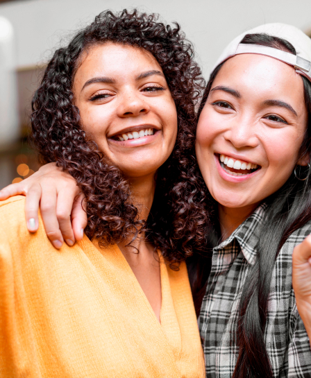 Friends Smiling and Embracing