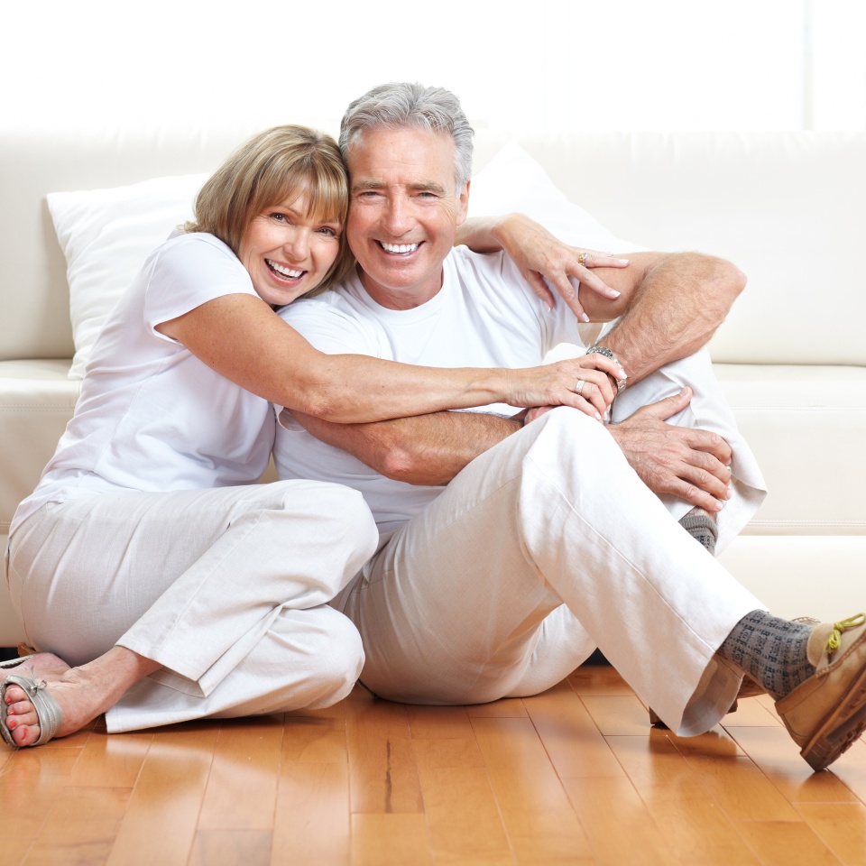 Senior couple at home smiling and happy
