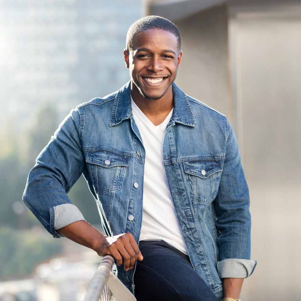 Casual lifestyle portrait of an african american male with perfect white teeth smile, commercial model