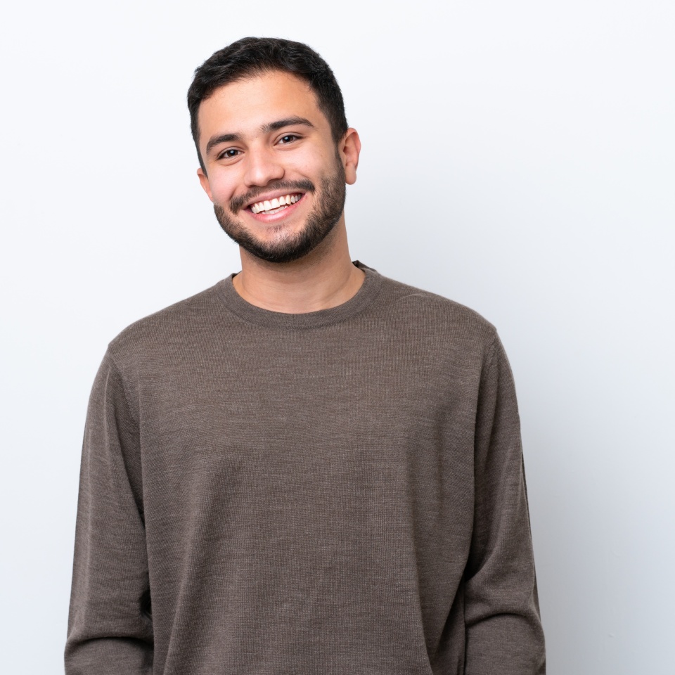 Young Brazilian man isolated on white background laughing