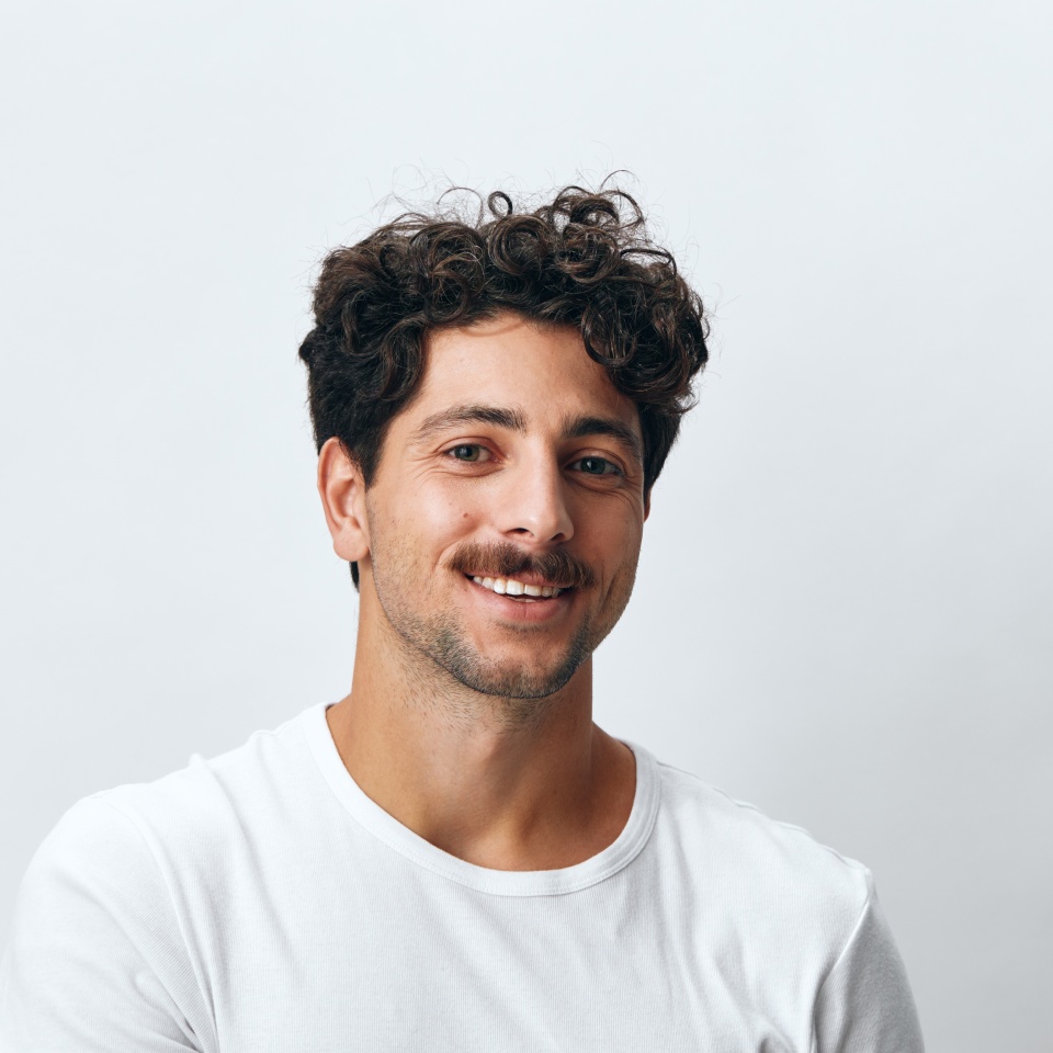 Hipster man isolated fashion background white t-shirt portrait smile