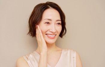 Portrait of a middle aged woman on a brown background